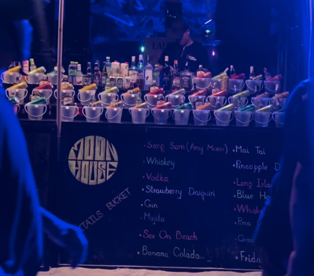 Vendor selling buckets at Koh Phangan Full Moon Party 2023